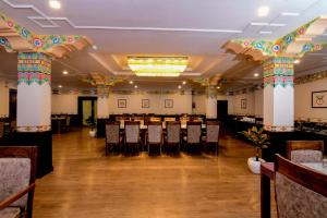 a large banquet hall with tables and chairs at Hotel Barath Ladakh in Leh