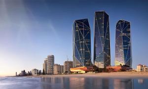 黄金海岸Jewel Beachfront Residences的一座拥有海滩的城市里一群高大的建筑