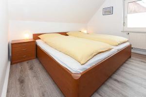Postel nebo postele na pokoji v ubytování Haus Flinthoern