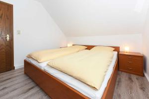 Postel nebo postele na pokoji v ubytování Haus Flinthoern