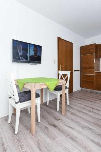 TV a/nebo společenská místnost v ubytování Haus Flinthoern