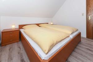 Postel nebo postele na pokoji v ubytování Haus Flinthoern