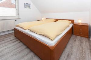 Postel nebo postele na pokoji v ubytování Haus Flinthoern
