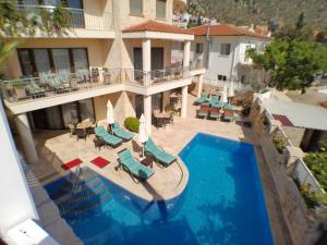 an aerial view of a hotel with a swimming pool at Truffle Residences in Kalkan