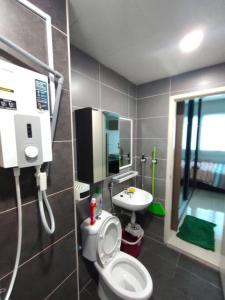 a bathroom with a toilet and a sink at Da Best Guesthouse One Maxim Sentul Nice Cozy Condo 3 Rooms Aircond in Sentul KL in Kuala Lumpur