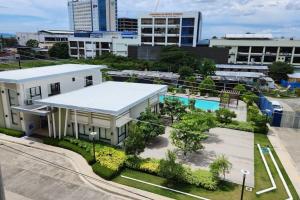 an aerial view of a building with a pool at Denise's Midtown Condo in Davao City