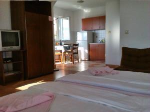 Posteľ alebo postele v izbe v ubytovaní Apartments Cajic