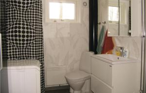 a bathroom with a toilet and a sink at Amazing Home In Ryssby With 1 Bedrooms, Sauna And Wifi in Hörda