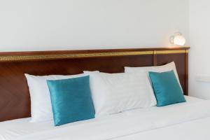 Postel nebo postele na pokoji v ubytování Hotel De Karon