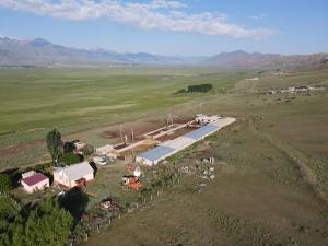 an aerial view of a farm in the middle of a field at Guest house Aidyn-Kul in Toguz-Bulak