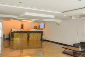 a lobby with a bar in the middle of a room at Water Park Condominium in Pattaya South