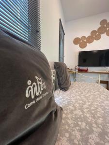 TV a/nebo společenská místnost v ubytování ComeHome Lamphun + 32 fotografií