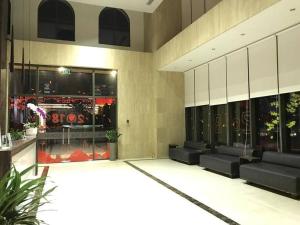 a lobby of a building with couches and a store at 1br-Stunning View-Hana Apart in Ho Chi Minh City +23 photos