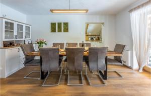 a dining room with a table and chairs at Cozy Home In Buzim With Sauna in Bužim