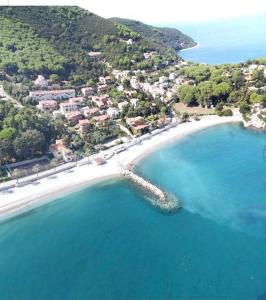 an aerial view of a beach with blue water at Maggiolino al mare in Cavo