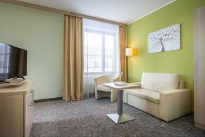 Uma televisão e/ou sistema de entretenimento em Hotel Mlynska