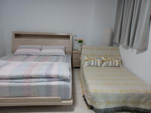 Voodi või voodid majutusasutuse Daiwen Homestay toas