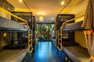 a room with two bunk beds and a hallway at The Hosteller Goa, Arpora in Arpora