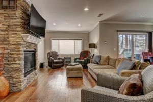 a living room with a couch and a fireplace at Tahoe Woods Hideout in South Lake Tahoe