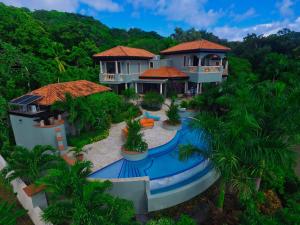 an aerial view of a house with a swimming pool at Casa Lynda - 3 Bedrooms in West Bay
