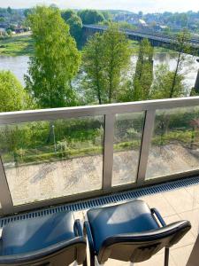 a view of a river from a train window at Rezidencija "Prieplauka" in Alytus