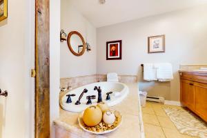 a bathroom with a tub and a sink at Crown Mountain Retreat in Carbondale +68 photos