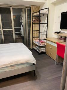 Postel nebo postele na pokoji v ubytování 果芒驛站旅店