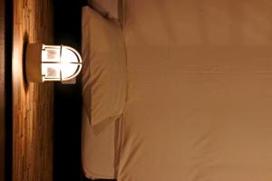 Una cama o camas en una habitación de リバティーリゾート大東温泉