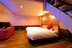 Una cama o camas en una habitación de リバティーリゾート大東温泉