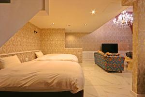 Una cama o camas en una habitación de リバティーリゾート大東温泉