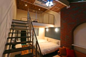 Una cama o camas en una habitación de リバティーリゾート大東温泉