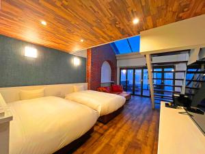 Una cama o camas en una habitación de リバティーリゾート大東温泉
