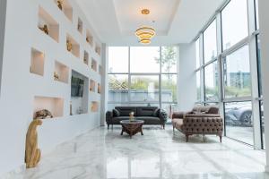 a living room with two couches and a table at The Hera Maltepe Otel & Spa in Istanbul