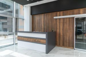 a reception desk in a building with a sign that reads reception at The Hera Maltepe Otel & Spa in Istanbul