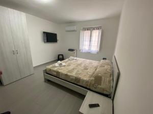 Postel nebo postele na pokoji v ubytování Affittacamere La Casa Dei Nonni
