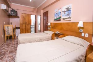 Postel nebo postele na pokoji v ubytování Ideal Praia Hotel