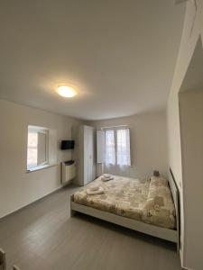 Un pat sau paturi într-o cameră la Affittacamere La Casa Dei Nonni