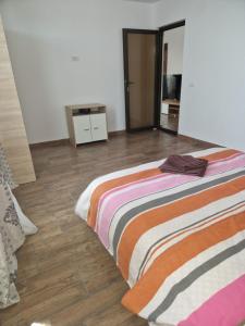 Postel nebo postele na pokoji v ubytování Sunshine Apartments