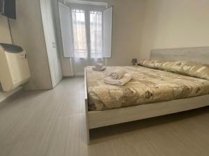 Postel nebo postele na pokoji v ubytování Affittacamere La Casa Dei Nonni