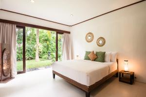 Ένα ή περισσότερα κρεβάτια σε δωμάτιο στο Dream View Villa