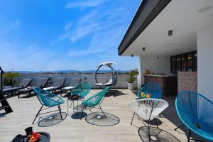 a group of chairs on a patio with a view at Luxury Rooms LaVie - Standard Rooms in Zadar