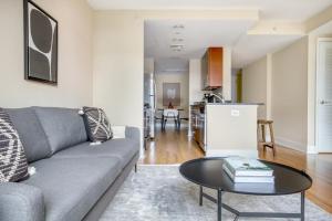 a living room with a couch and a table at Mount Vernon 2BR w WD Gym nr Chinatown WDC-565 in Washington