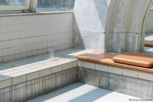 a bath tub with a glass on top of it at KIRO Hiroshima by THE SHARE HOTELS in Hiroshima