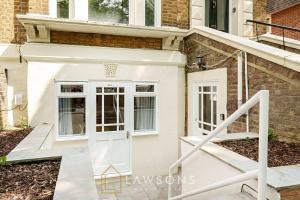 a white door in front of a house at Stylish Living by Lawsons with 3 Ensuites in Windsor