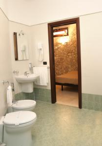 a bathroom with a toilet and a sink at Agriturismo San Martino in Pozzuoli