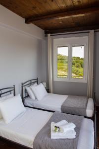 Postel nebo postele na pokoji v ubytování Mylos House with sea view