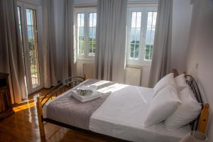 Postel nebo postele na pokoji v ubytování Mylos House with sea view