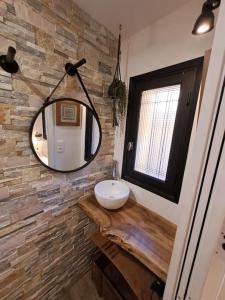 a bathroom with a sink and a mirror at T2 avec terrasse à La Fossette in Le Lavandou