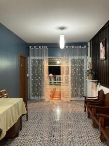 Postel nebo postele na pokoji v ubytování บ้านนภภูเกตส์เฮ้าส์
