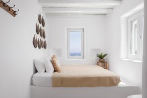 Ένα ή περισσότερα κρεβάτια σε δωμάτιο στο El Sueno Villa Mykonos
